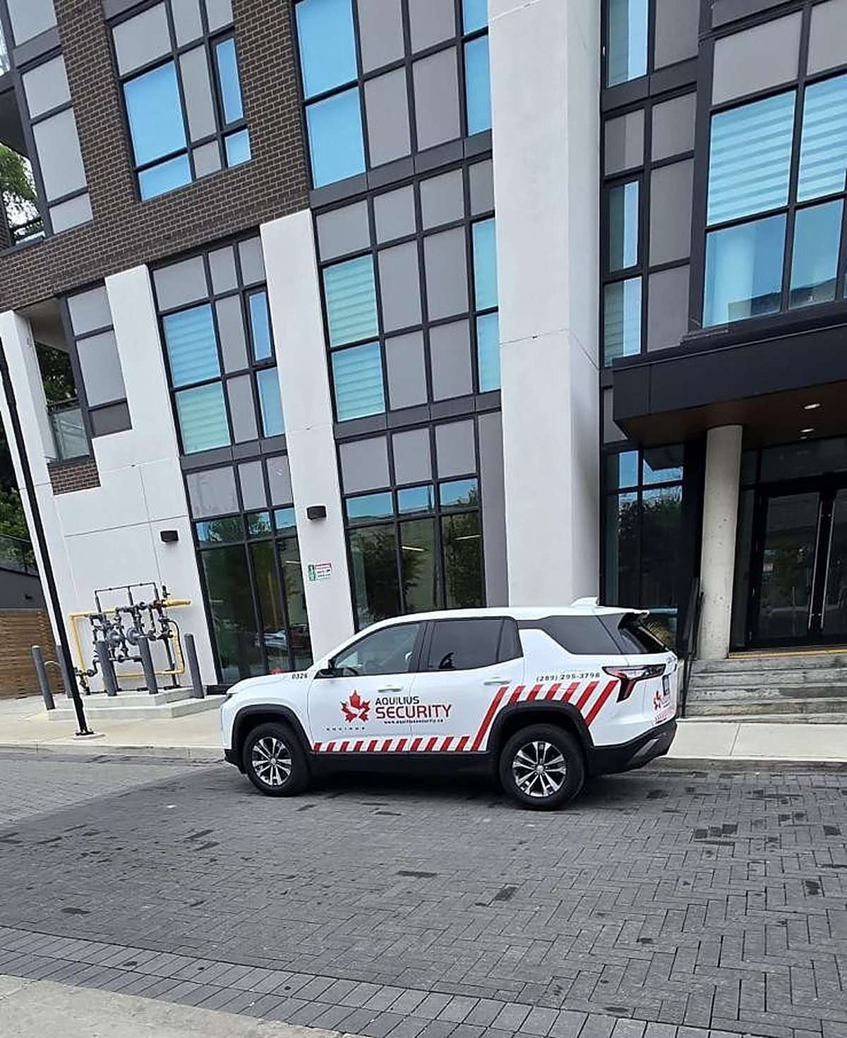 Aquilius Security patrol vehicle at a building